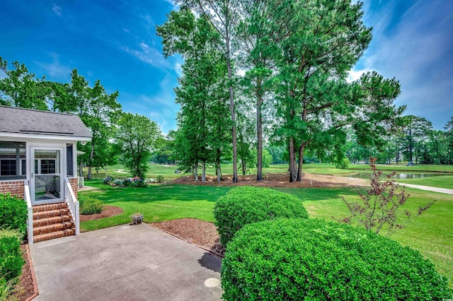 3334 Cedar Creek Run, Little River, SC 29566 - view of grassy yard featuring a patio area, a water view, and view of wooded area