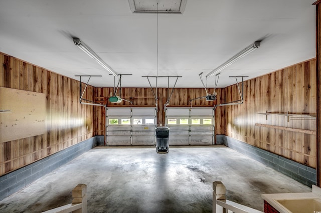 3334 Cedar Creek Run, Little River, SC 29566 - garage featuring wood walls and a garage door opener