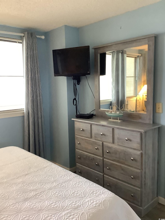 523 S Ocean Blvd Unit 705, North Myrtle Beach, SC 29582 - bedroom with multiple windows and baseboards