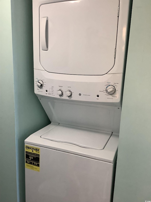 523 S Ocean Blvd Unit 705, North Myrtle Beach, SC 29582 - laundry room featuring stacked washer and clothes dryer
