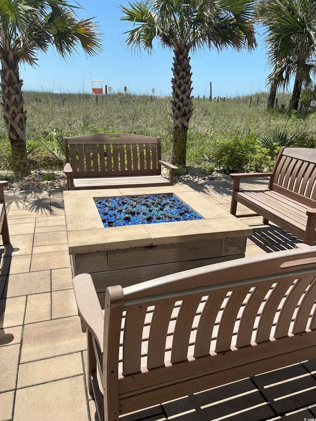 523 S Ocean Blvd Unit 705, North Myrtle Beach, SC 29582 - view of patio featuring an outdoor fire pit