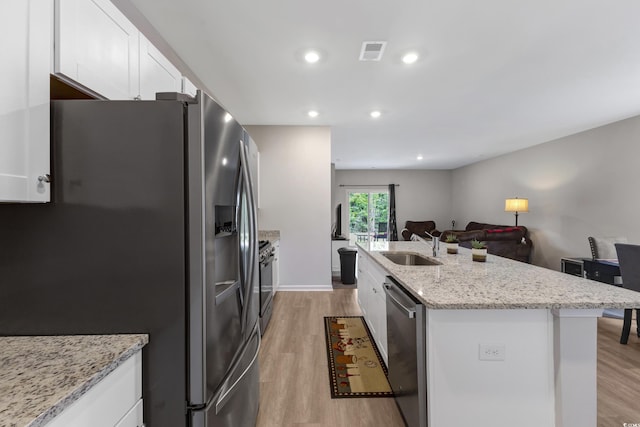 120 Carolina Lakes Blvd, Myrtle Beach, SC 29588 - kitchen with stainless steel appliances, light wood-style flooring, white cabinets, and recessed lighting