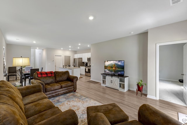 120 Carolina Lakes Blvd, Myrtle Beach, SC 29588 - living area featuring light wood finished floors, recessed lighting, and baseboards