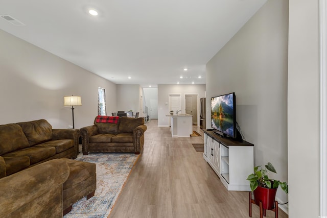 120 Carolina Lakes Blvd, Myrtle Beach, SC 29588 - living room with light wood-style flooring, recessed lighting, and baseboards