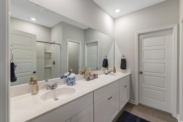 120 Carolina Lakes Blvd, Myrtle Beach, SC 29588 - bathroom with walk in shower, double vanity, baseboards, and wood tiled floors
