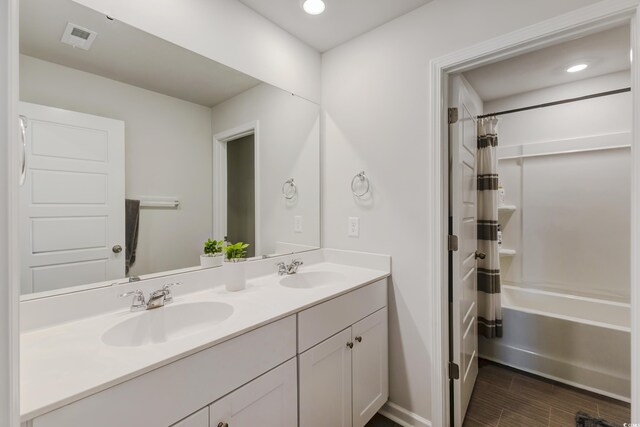 120 Carolina Lakes Blvd, Myrtle Beach, SC 29588 - full bath with double vanity, shower / tub combo with curtain, wood finish floors, recessed lighting, and baseboards