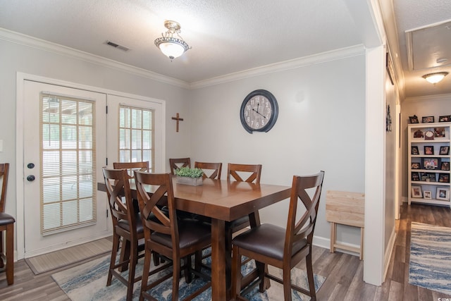 2510 Redwood St, Georgetown, SC 29440 - dining space featuring wood finished floors, ornamental molding, baseboards, and a textured ceiling