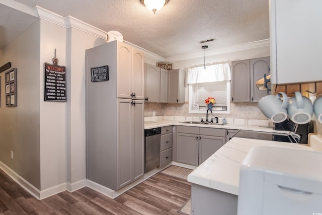 2510 Redwood St, Georgetown, SC 29440 - kitchen with stainless steel dishwasher, a sink, a textured ceiling, dark wood finished floors, and ornamental molding