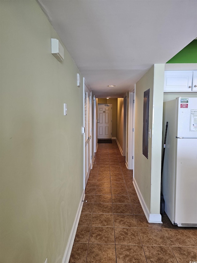4103 N Ocean Blvd N Unit 204, North Myrtle Beach, SC 29582 - hall with baseboards, dark tile patterned floors, and electric panel