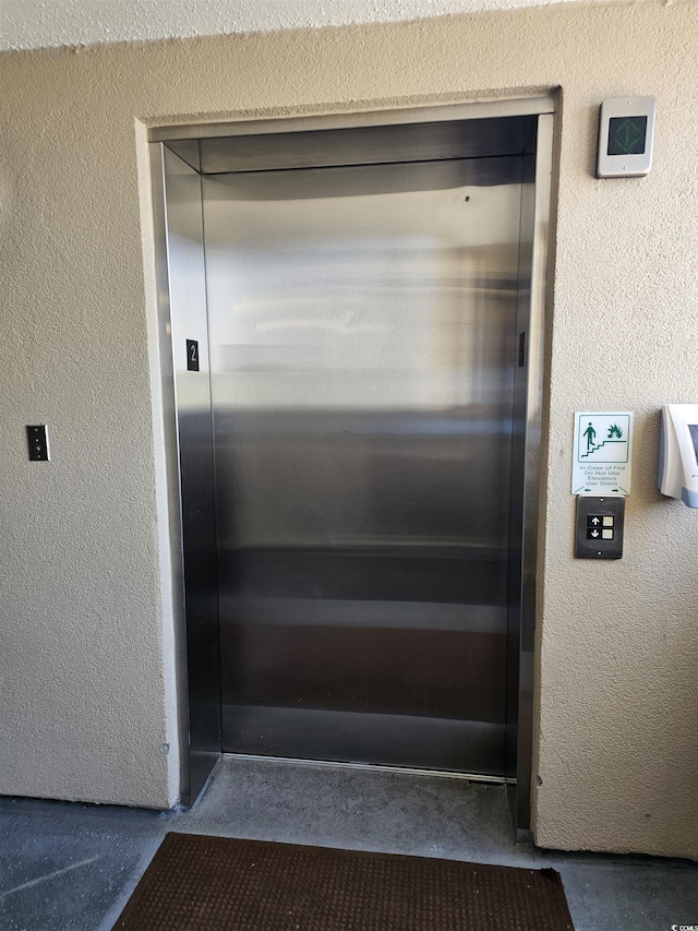 4103 N Ocean Blvd N Unit 204, North Myrtle Beach, SC 29582 - elevator with concrete flooring and a textured wall