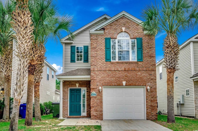 422 S Poplar Dr, Surfside Beach, SC 29575 - view of front facade with an attached garage, driveway, and brick siding