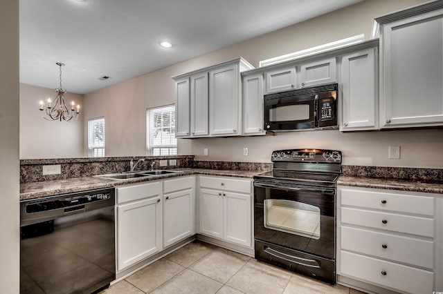 422 S Poplar Dr, Surfside Beach, SC 29575 - kitchen featuring black appliances, a sink, a chandelier, light tile patterned floors, and hanging light fixtures