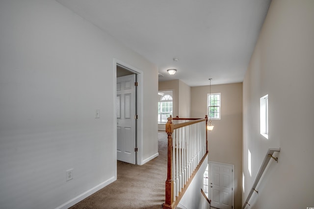 422 S Poplar Dr, Surfside Beach, SC 29575 - hallway featuring an upstairs landing, carpet floors, and baseboards