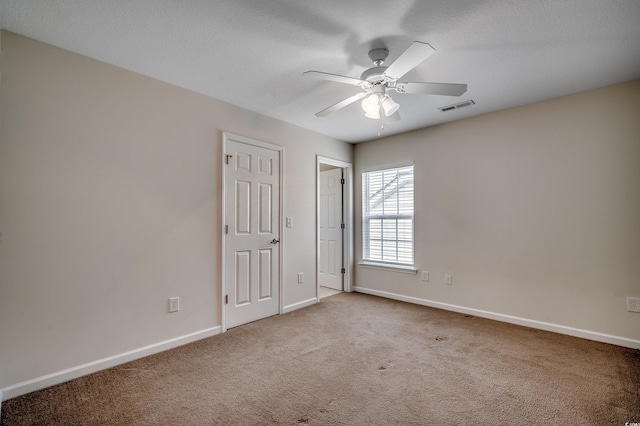 422 S Poplar Dr, Surfside Beach, SC 29575 - unfurnished bedroom with carpet, baseboards, and a ceiling fan