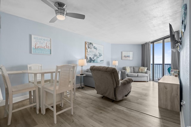 9550 Shore Dr Unit 529, Myrtle Beach, SC 29572 - dining space featuring light wood-style flooring, floor to ceiling windows, and ceiling fan