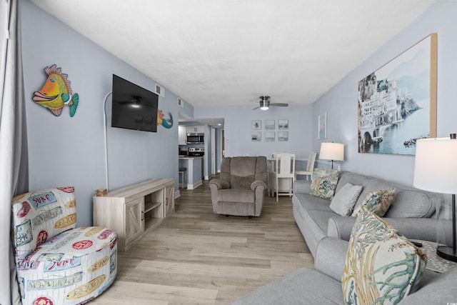 9550 Shore Dr Unit 529, Myrtle Beach, SC 29572 - living room with light wood-style floors and a ceiling fan