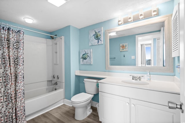 9550 Shore Dr Unit 529, Myrtle Beach, SC 29572 - full bathroom featuring wood finished floors, toilet, shower / bath combo with shower curtain, vanity, and baseboards