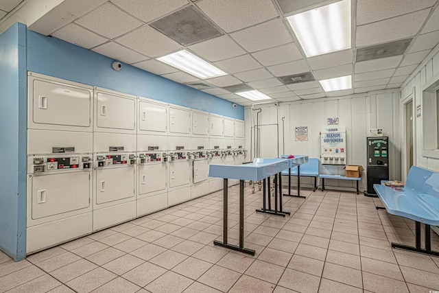 9550 Shore Dr Unit 529, Myrtle Beach, SC 29572 - game room with stacked washer / drying machine, a paneled ceiling, and light tile patterned floors