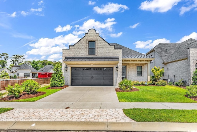 8469 Cape Dutch Loop, Myrtle Beach, SC 29572 - french country home with a standing seam roof, concrete driveway, metal roof, and brick siding