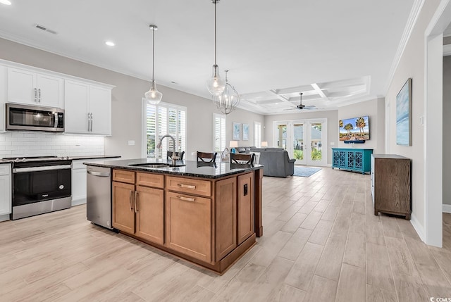 8469 Cape Dutch Loop, Myrtle Beach, SC 29572 - kitchen featuring stainless steel appliances, a sink, light wood-style floors, recessed lighting, and crown molding