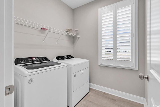 8469 Cape Dutch Loop, Myrtle Beach, SC 29572 - laundry room with separate washer and dryer, baseboards, and light wood-style flooring