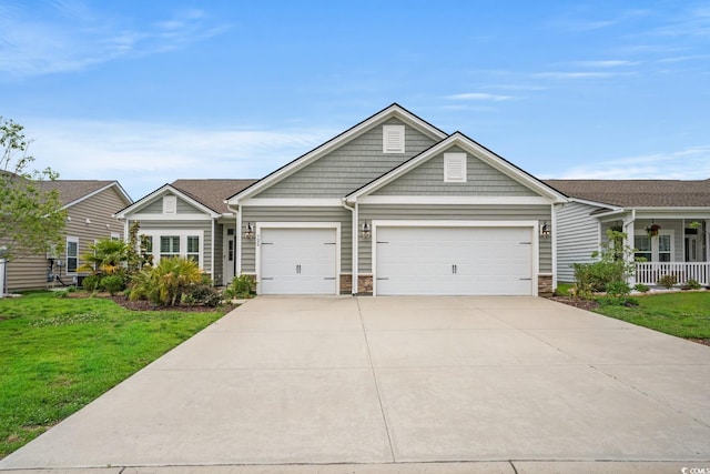 720 Little Fawn Way, Myrtle Beach, SC 29579 - view of front facade with a front lawn, a garage, driveway, and stone siding