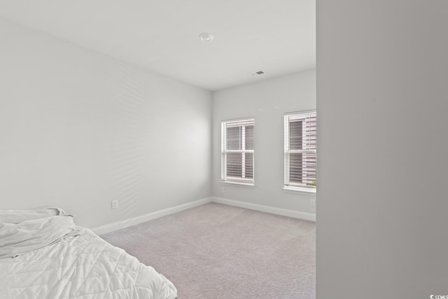 720 Little Fawn Way, Myrtle Beach, SC 29579 - unfurnished bedroom with baseboards and light carpet