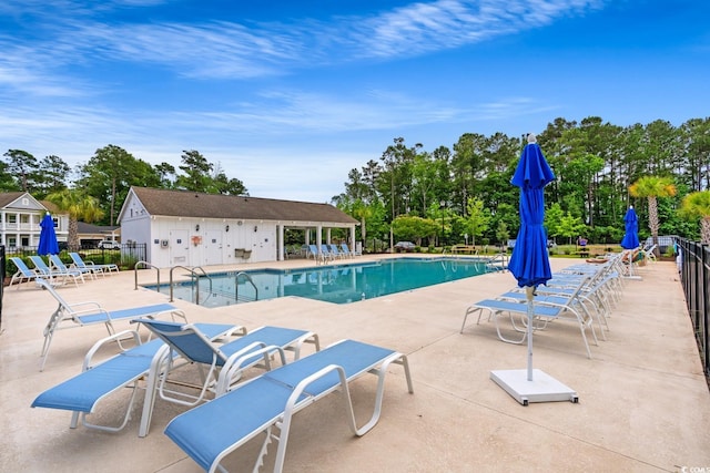 720 Little Fawn Way, Myrtle Beach, SC 29579 - community pool with a patio area and view of scattered trees