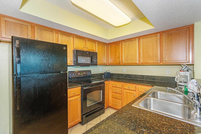 504 N Ocean Blvd Unit 1804A/B, Myrtle Beach, SC 29577 - kitchen with black appliances, a sink, light tile patterned floors, and brown cabinets