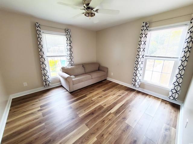 302 Silver Fox Trl, Myrtle Beach, SC 29588 - living area featuring wood finished floors, ceiling fan, and baseboards