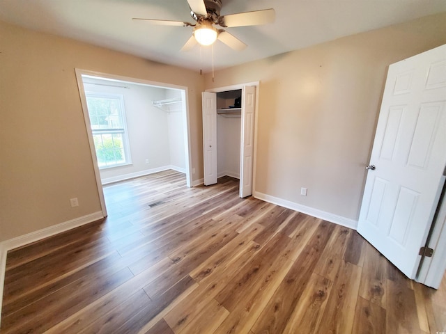 302 Silver Fox Trl, Myrtle Beach, SC 29588 - unfurnished bedroom with wood finished floors, baseboards, and a ceiling fan