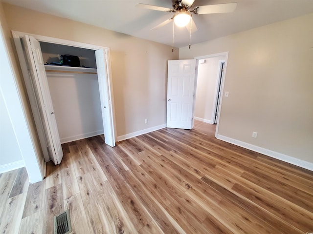 302 Silver Fox Trl, Myrtle Beach, SC 29588 - unfurnished bedroom with light wood-style flooring, baseboards, a closet, and ceiling fan