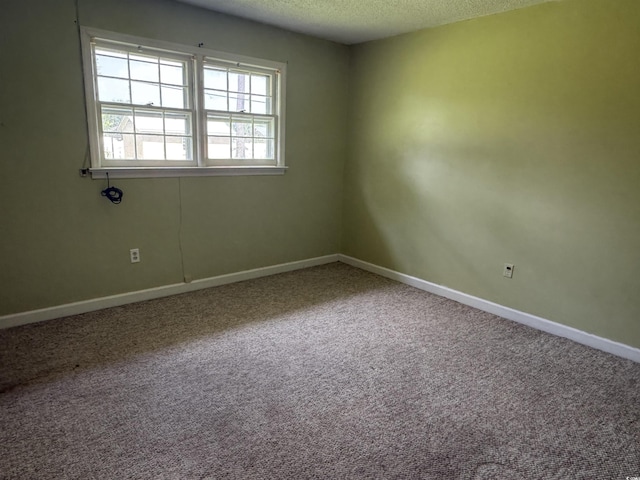 1002 S Beech Ave, Andrews, SC 29510 - carpeted spare room featuring a textured ceiling and baseboards