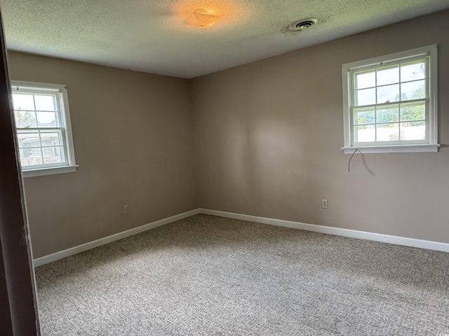 1002 S Beech Ave, Andrews, SC 29510 - carpeted empty room featuring a textured ceiling and baseboards