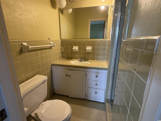 1002 S Beech Ave, Andrews, SC 29510 - bathroom with tile patterned floors, toilet, vanity, a textured wall, and a stall shower
