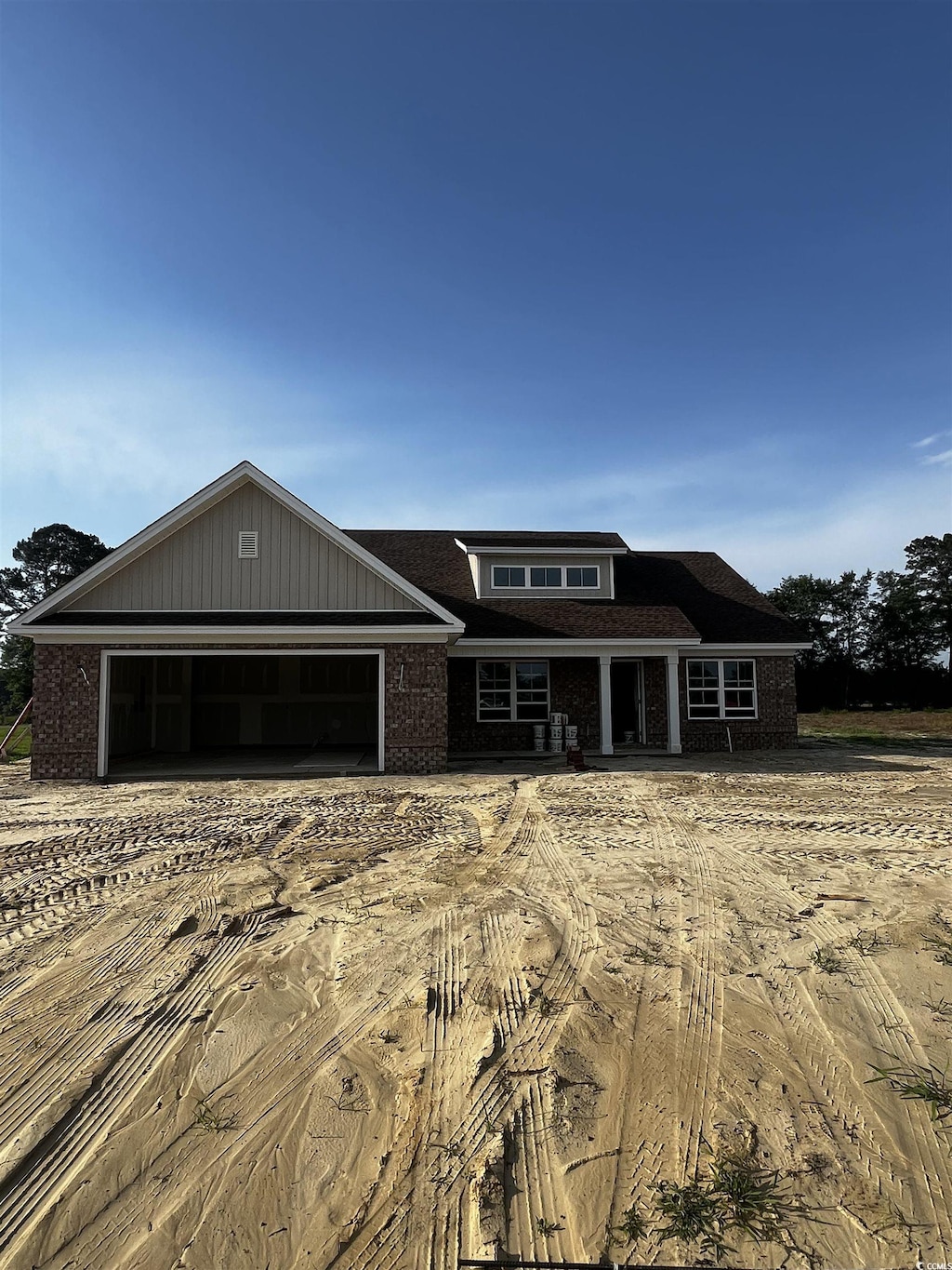 3444 Asbury Rd, Aynor, SC 29511 - view of front of property featuring brick siding, a garage, and driveway