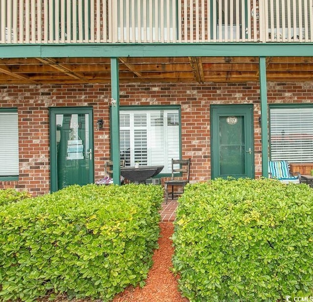 4516 Seaview St Unit 137, North Myrtle Beach, SC 29582 - property entrance with brick siding and a balcony
