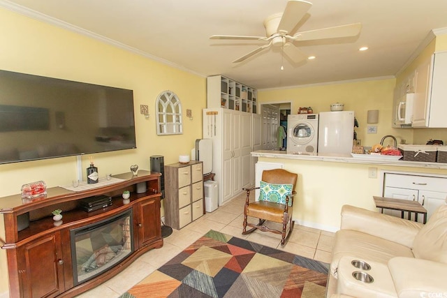 4516 Seaview St Unit 137, North Myrtle Beach, SC 29582 - living room with stacked washing machine and dryer, ornamental molding, ceiling fan, light tile patterned floors, and recessed lighting