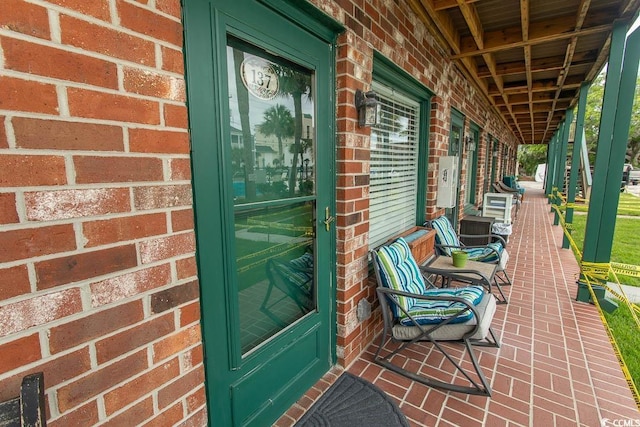 4516 Seaview St Unit 137, North Myrtle Beach, SC 29582 - entrance to property with brick siding and a porch