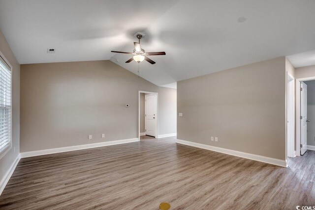 3129 Slade Dr, Conway, SC 29526 - unfurnished room with ceiling fan, wood finished floors, lofted ceiling, and baseboards