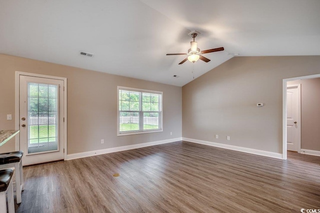 3129 Slade Dr, Conway, SC 29526 - unfurnished living room featuring a ceiling fan, wood finished floors, plenty of natural light, and vaulted ceiling