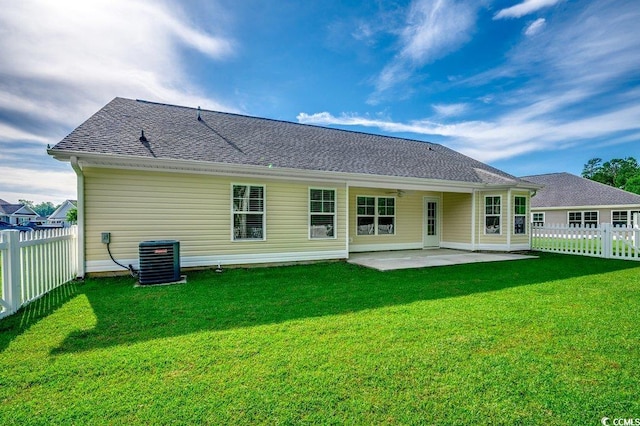 3129 Slade Dr, Conway, SC 29526 - back of property featuring central AC, a patio, and a shingled roof