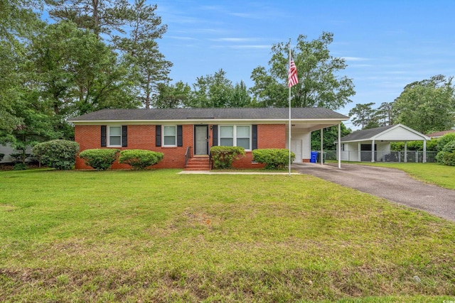 203 Longwood Ln, Conway, SC 29527 - ranch-style house with asphalt driveway, brick siding, and an attached carport