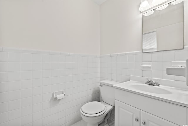 203 Longwood Ln, Conway, SC 29527 - half bathroom with tile walls, toilet, vanity, and wainscoting