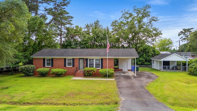 203 Longwood Ln, Conway, SC 29527 - ranch-style home with driveway, an attached carport, and brick siding