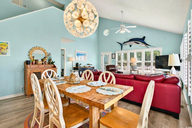 6 Indigo Ct, Ocean Isle Beach, NC 28469 - dining area with a ceiling fan, wood finished floors, high vaulted ceiling, and baseboards