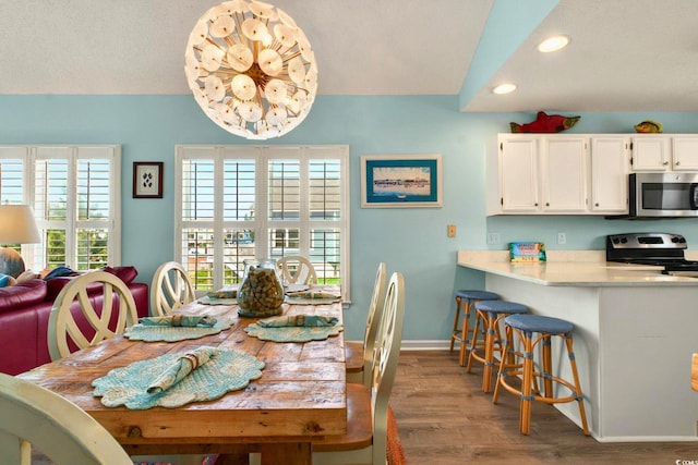 6 Indigo Ct, Ocean Isle Beach, NC 28469 - dining space featuring recessed lighting, wood finished floors, and baseboards