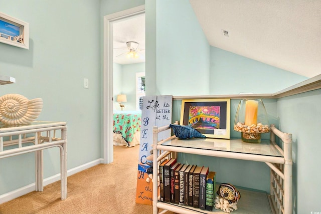 6 Indigo Ct, Ocean Isle Beach, NC 28469 - hallway with carpet, lofted ceiling, and baseboards