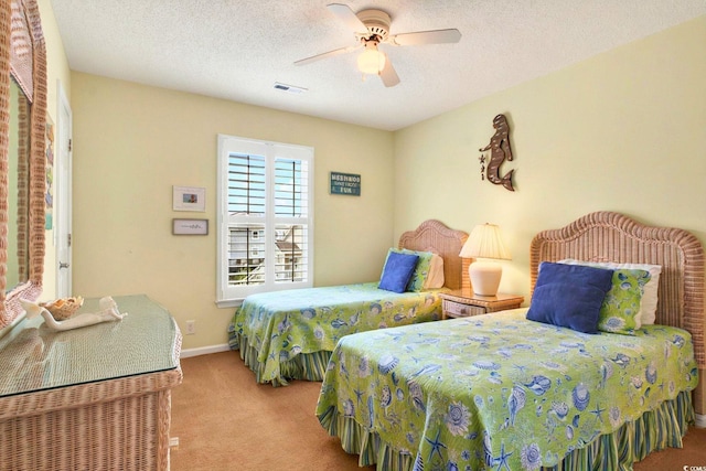 6 Indigo Ct, Ocean Isle Beach, NC 28469 - carpeted bedroom featuring a ceiling fan, a textured ceiling, and baseboards
