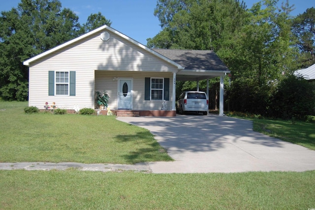 304 S Magnolia Ave, Andrews, SC 29510 - view of front of house with driveway, an attached carport, and a front lawn